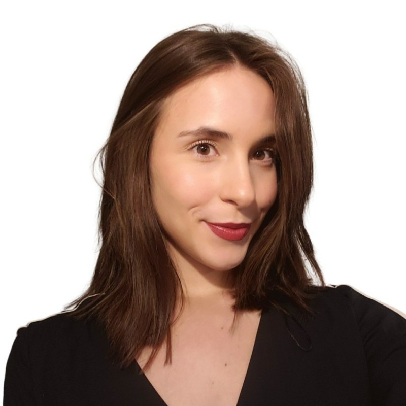 headshot of aly hill - Aly is wearing a black top against a pure white backdrop
