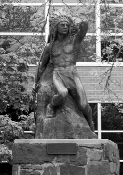 The Ute Brave Statue outside the Student Union building. The placard reads: Ute Brave by Avard Fairbanks Gift of the Classes of 1946, 1947 and 1951. Photo used by permission from James Fisher. 